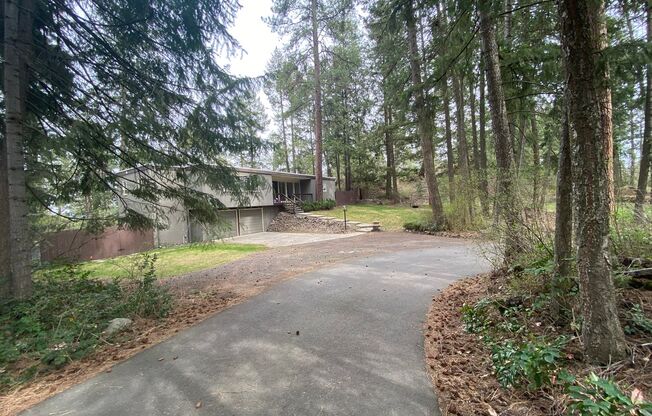 Unique View Property 3 bed, 3 bath located near the Kalispel Golf & Country Club & Whitworth. You must see this one!