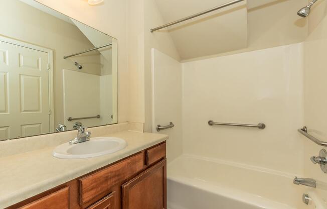 a room with a sink and a mirror