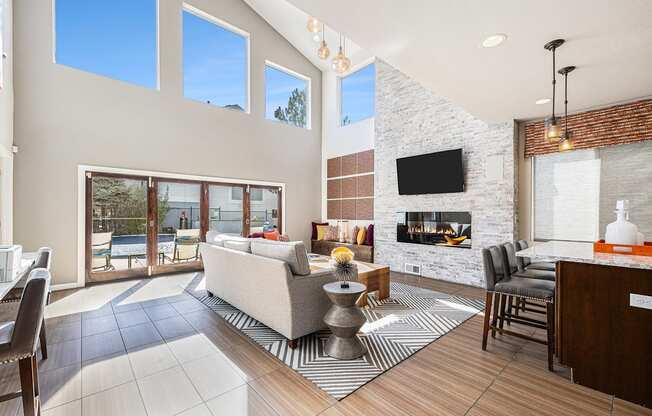 A modern living room with a fireplace and a television.