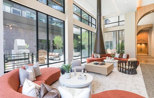 Stylish indoor and outdoor lounge spaces offer cozy spots to relax, complete with modern seating and warm natural light.