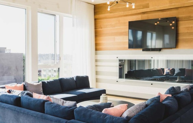 North Building Lobby features glass-walled fireplace and HDTV, perfect for cozy gatherings