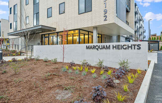 an image of the front of the magnum heights apartments building