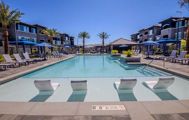 Resort style pool with floating pool chairs