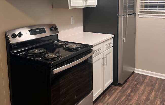 a kitchen with a stove and a refrigerator