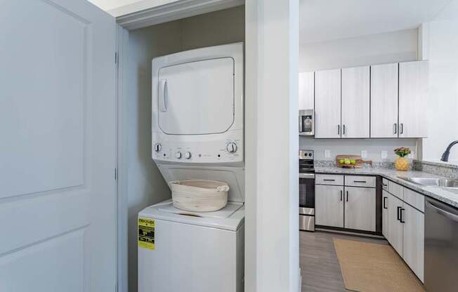 A white oven with a sticker on it is in a kitchen.