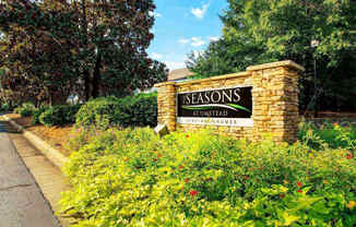 Entrance sign to Seasons at Umstead at the entrance of an apartment community