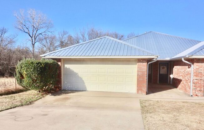 FOR LEASE! Nicely Remodeled 3 BR - 2 BA Brick Duplex With a 2 Car Garage in Weatherford.