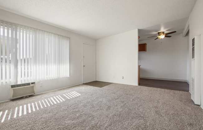 Living room with carpeted flooring, air conditioning