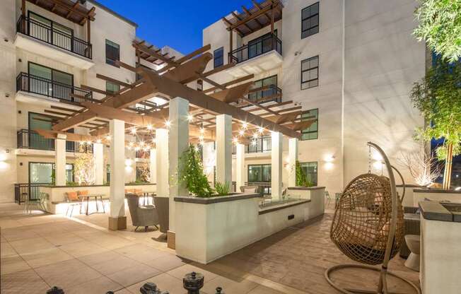 A chess set is set up on a patio.