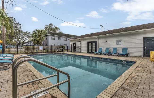 the pool at 1861 muleshoe road has a resort style pool and lounge chairs