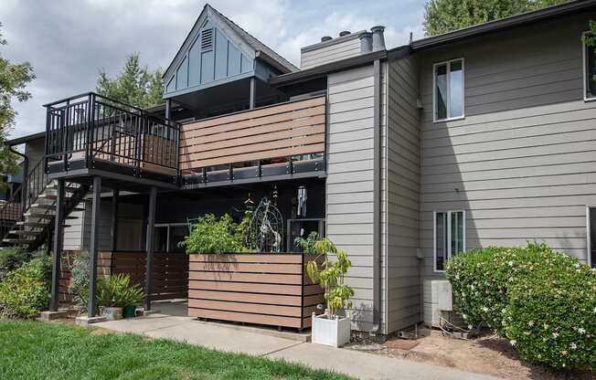 An apartment with a balcony and a small garden at Pepperwood Apartments, California, 95661