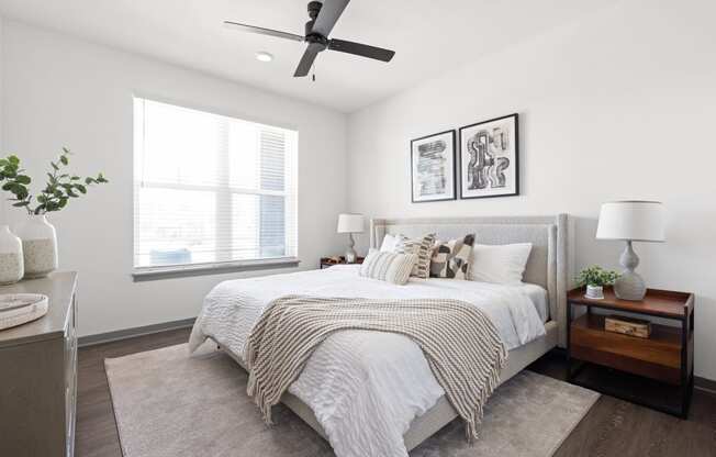 a bedroom with a large bed and a ceiling fan at Palm Grove in Ellenton, FL 34222