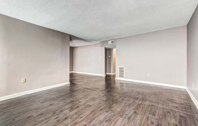 Whitney Manor Apartments in Gretna, LA photo of living room with hardwood flooring