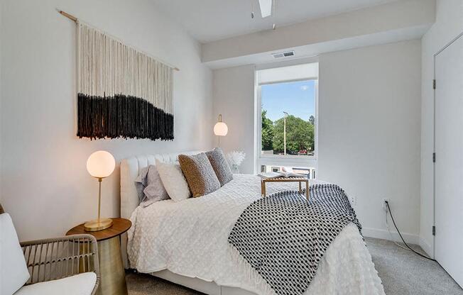 a bedroom with a bed and a window
