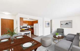 A modern living room with a dining table set for two. at Rock Creek in Billings, MT.