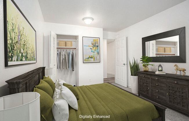 A bedroom with a closet, bed and a wooden dresser at Hampton Lakes Apartments, Michigan, 49534