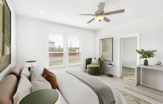 One of four stylish bedrooms in this single-family home at Amavi Celina. The design combines soft tones and natural light for an inviting, elevated feel.