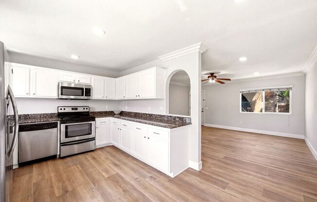 COMPLETELY UPGRADED 3 Bedroom 2 Bath Condo w/ Laundry and Garage. MUST SEE!!!