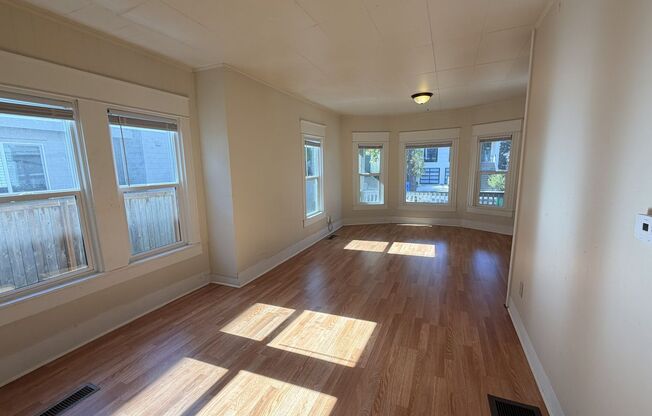 Charming 1907 house with stunning front porch and spacious back yard!