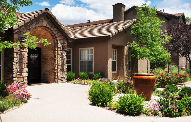 Leasing Office stone exterior of River Walk at Puerto de Corrales Apartments