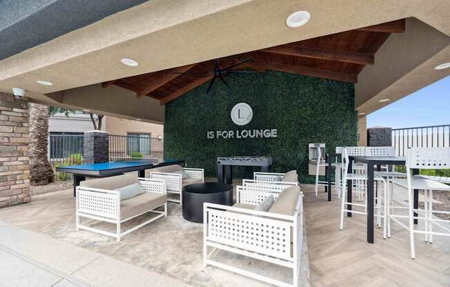 A patio with a pool table and chairs is labeled  at The Laurel Apartments, Arizona