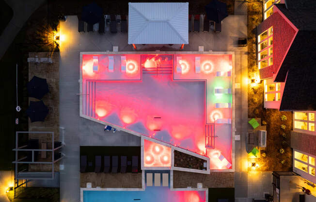 a birdseye view of a building with a neon sign on it  at The Edison at Tiffany Springs, Kansas City, Missouri