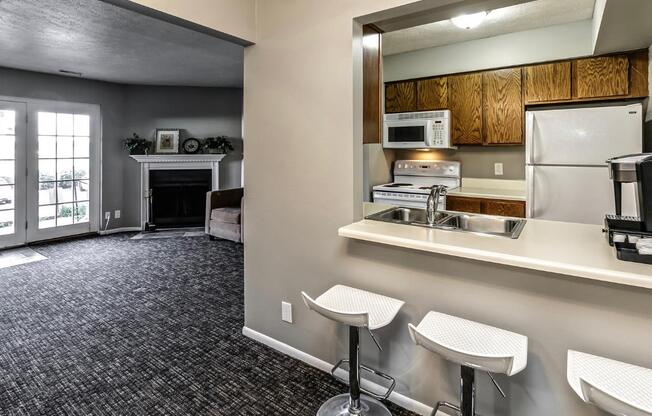 a kitchen with a sink and a refrigerator