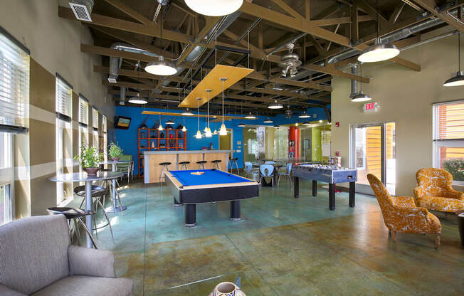 a game room with a pool table and ping pong at Village Club of Rochester Hills, Michigan