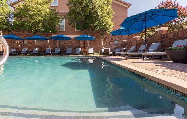 This is a photo of the pool area at The Brownstones Townhome Apartments in Dallas, TX.