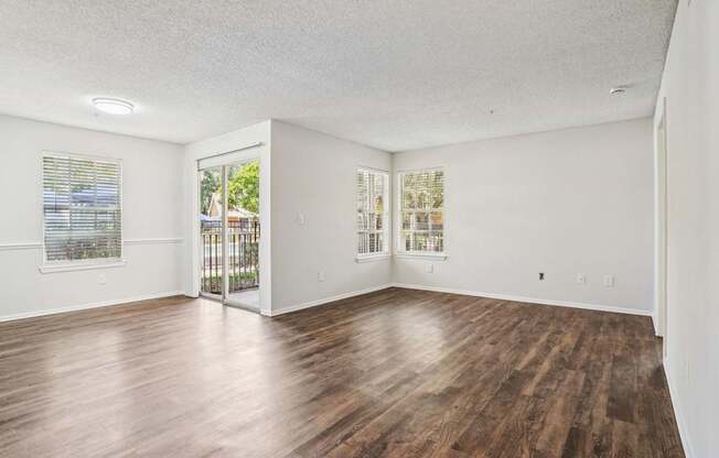 A room with wooden floors and white walls.