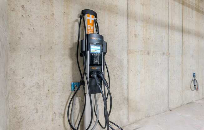 a drill press hangs on the wall of a building