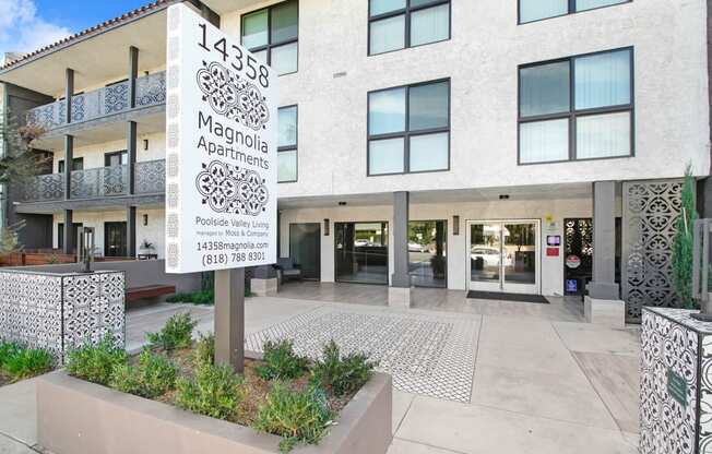 the front of a building with a sign in front of it