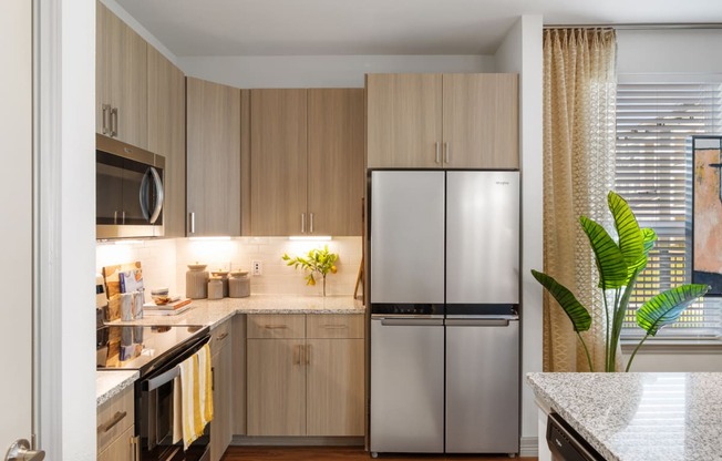 Kitchen with stainless steel appliances and custom cabinetry