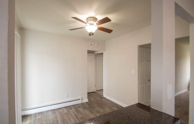 This is a photo of the dining room from the kitchen pass through window in the 631 square foot, B-style (Ranch) 1 bedroom/1 bath floor plan at Colonial Ridge Apartments in the Pleasant Ridge neighborhood of Cincinnati, OH.