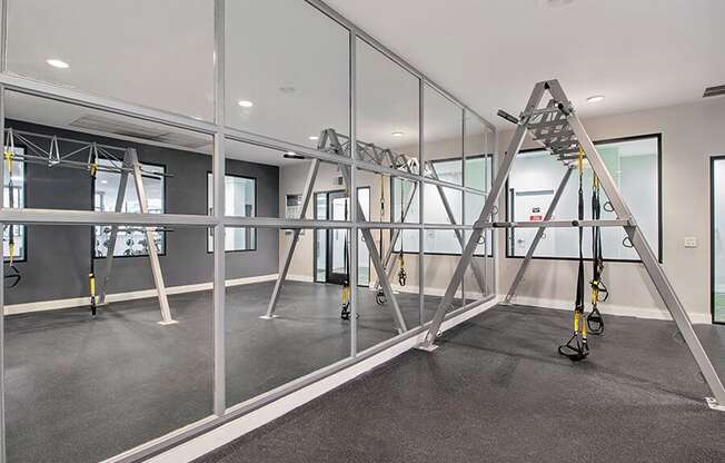 Community Fitness Center with Equipment at Madison Park Apartments located in Anaheim, CA.