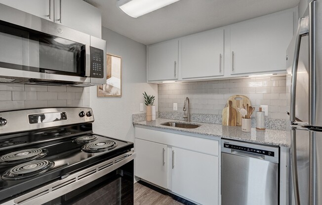 Step into the sleek and modern kitchen at Crossings @ 501 Apartments, where style meets functionality. Enjoy premium appliances and ample counter space for all your culinary adventures. Schedule your tour today and make this space your new home!