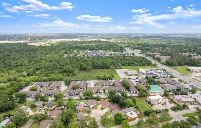 an aerial view of a neighborhood with houses and trees