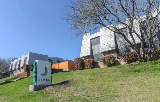 a building with a green sign in front of it