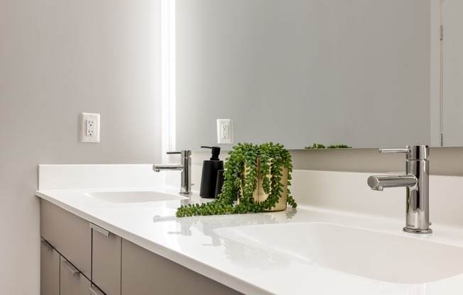 Indulge in tranquility with Modera Montville's serene bathrooms, boasting dual vanities and elegant marble countertops.