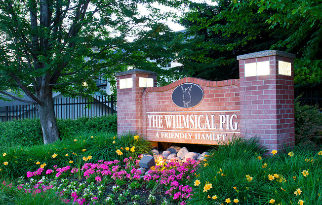 The Whimsical Pig Apartments Exterior Monument Sign