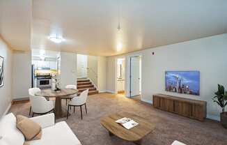 a living room with a couch and a table and a tv