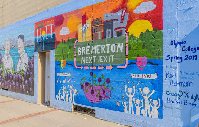 A mural on a wall with the words at Spyglass Hill Apartments, Bremerton, 98337