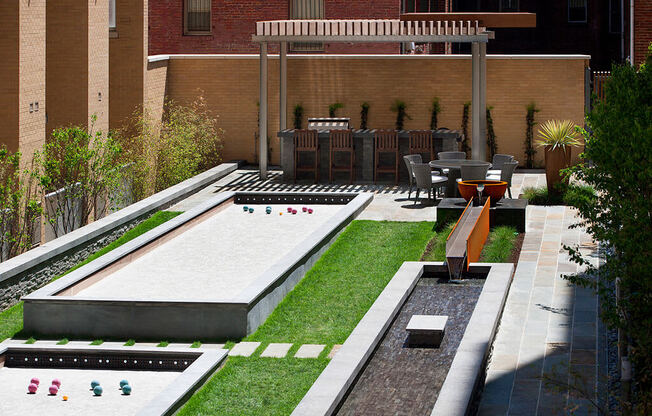 Courtyard with bocce courts, cozy lounges, gas grills and outdoor bar at Highland Park at Columbia Heights Metro, Washington, DC, 20010