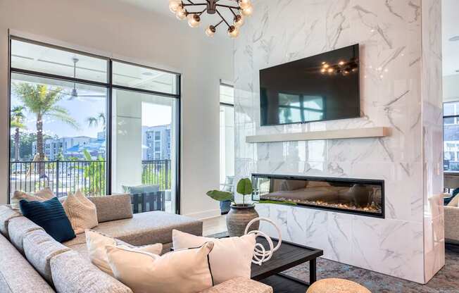 Resident lounge seating, fireplace, and TV.