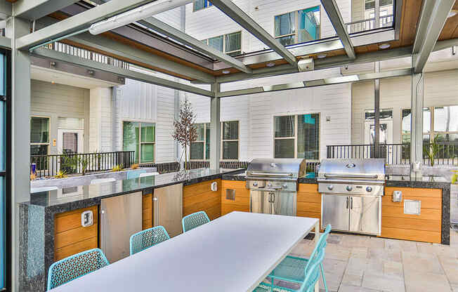 Outdoor Grill With Intimate Seating Area at Link Apartments® Montford, North Carolina