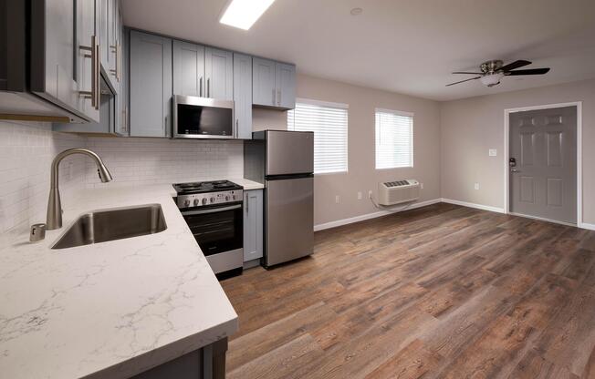 a kitchen with an island in the middle of a room