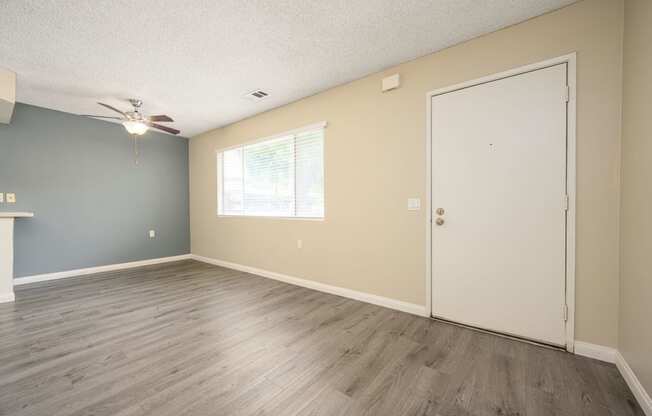 a bedroom with hardwood floors and a ceiling fan at Sagewood Gardens Senior Apartments, Hacienda Heights, CA
