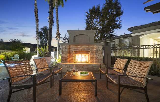 Estancia at Mission Grove Apartments Fireplace at Night