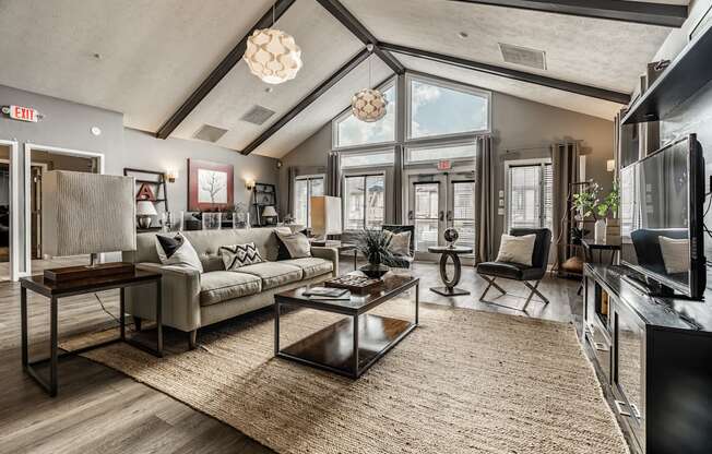 A modern living room with a large couch and a coffee table