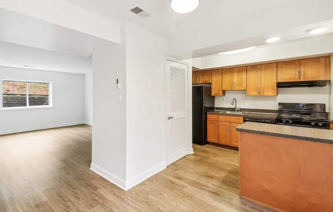 a kitchen with a counter top and a wall with different shapes on it